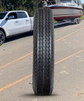 All Weather Radial Trailer Tire Set 4.80-12 6PR Load Range C on asphalt with truck towing boat