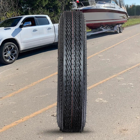 All Weather Radial Trailer Tire Set 4.80-12 6PR Load Range C on asphalt with truck towing boat