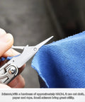 Scissors from Everyday Carry 18 In 1 Multitool Pliers Set With Graded Hardness Steel cutting blue fabric