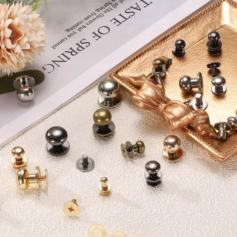Badass Twenty Piece Round Head Button Stud Screws Seven Mm Brass Chicago Style Screws displayed on a tray with various colors and finishes.