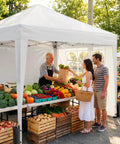 Market stall under Easy Up 10x10 Pop Up Canopy With Sidewalls One Push Instant Setup In A Snap No Tools Needed, selling produce.