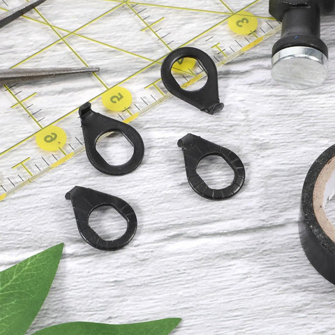 Four black safety washers with unique shape for Heavy Duty Bicycle Hub Nut Set Built Tough Three Eighths Inch Black Flange Axle Nuts