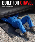 Creeper Rolling Mat Pro Grade 60 Inch By 28 Inch Portable Car Repair Mat used on gravel surface under vehicle