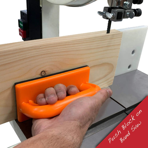 Using the Pro Grade 4 Piece Woodworking Safety Kit angled handle push block on a bandsaw with wooden plank