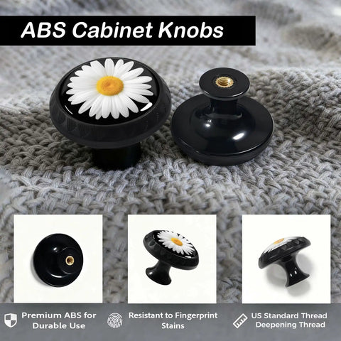 12 Pack White Daisy Cabinet Knobs With Bright Yellow Center On Matte Black Base For Kitchen And Bathroom Drawers on textured surface.