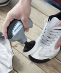 Using 16 Piece Versa Power Scrubber Accessory Value Kit with 15 cleaning pads to clean a white sneaker with non-scratch foam pad.
