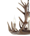 Close-up of Brown Adjustable Resin Antler Three Light LED Chandelier showing faux antlers and LED lights for farmhouse vibe.