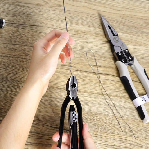 Using 6 Inch Safety Wire Pliers with stainless steel wire on wooden surface for aircraft machinery and vehicles lock wire tasks