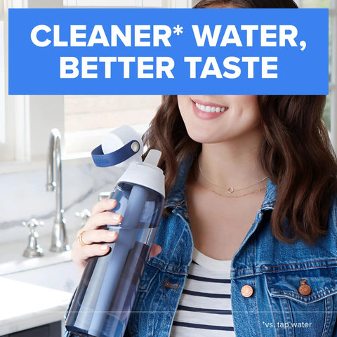 Woman in kitchen holding Hard Sided BPA Free Filtering Water Bottle With Premium Filter 26 Oz On The Go Hydration