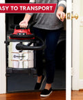 Premium 5 Gallon Wet Dry Shop Vac With Badass 135 Air Watt Suction, Rust Resistant Stainless Steel Tank, 16 Foot Extended Reach, And Six Piece Accessory Bundle For Daily Garage Cleaning being carried through a doorway.