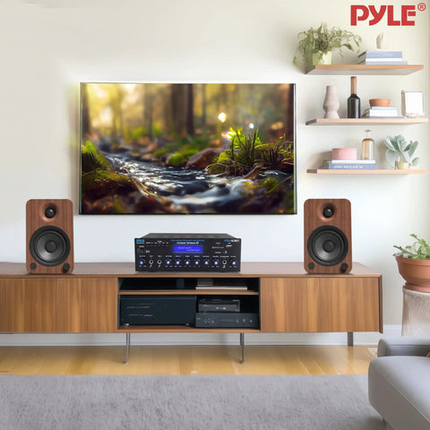 Wireless Bluetooth Stereo Amplifier Multi Channel 200 Watt Power Home Audio Receiver centered in home theater setup on wooden cabinet