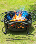 36 Inch Round Outdoor Fire Pit With Crossweave Design In Black Iron For Patio Backyard Garden And Camping Includes Spark Screen And Fire Poker For Cozy Bonfires And Warm Gatherings on grass