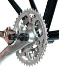 Universal Crank Puller For Square Taper ISIS Drive And Octalink Pro Grade Compact Bike Tool in use on bicycle crank arm
