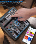 Hand using 6 Channel Wireless DJ Mixer With Bluetooth Streaming And DSP Effects USB Audio Interface next to smartphone with app