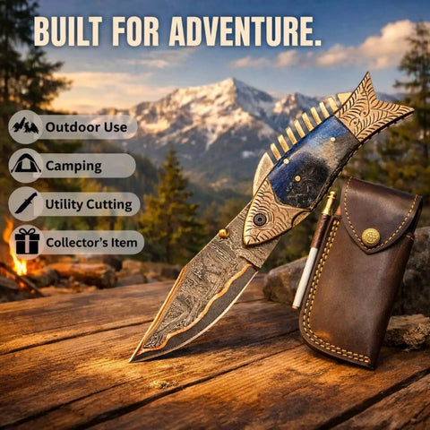 Fish Style Folding Knife With Ladder Pattern Damascus Blade And Blue Resin Handle, leather sheath on wooden surface