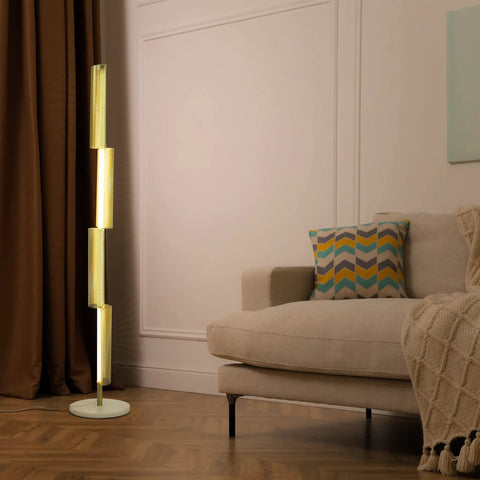 Callie LED Floor Lamp 55 Inch Tall Industrial Style With Metal Grid Shade in cozy living room next to beige sofa