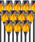 Image of 12-Pack Solar Christmas Lights Outdoor With Flickering Flame Tiki Torches Waterproof Garden Lights Auto On Off Patio Decor 12 LED Solar Lamps For Yard Pathway And Totally Lit Holiday Glow, showing flame-style LED torches.