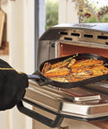 Person using Heavy Duty Heat Resistant Grill Gloves For Outdoor Cooking With Dope Wrist Protection To Stop Burns Ideal For Grilling Barbecues