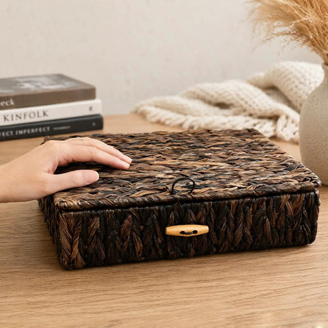 Natural Water Hyacinth Wicker Storage Baskets With Lids Set Of 2 on table, hand touching handwoven rustic organizer bin