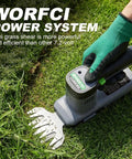 Green-gloved hand using 12V Cordless Grass Shear And Hedge Trimmer 2 In 1 Handheld Electric Shrub Cutter on lawn, powered by WORFCI system.