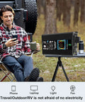 Man enjoying coffee with Weekend Warrior Solar Power Kit 6000W Inverter providing power for phone and laptop outdoors.