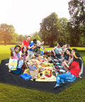 Group enjoying picnic on Heavy Duty Waterproof 10x10 Tarpaulin Ground Cover For Outdoor Camping in park