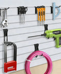 Heavy-Duty Slatwall Baskets and Hooks Kit for Standard Slatwall Panels, A Must-Have for Garage and Workshop Organization, 32-Piece Set With 4 Baskets and 28 Hooks, Fits Most Slatwall Systems in use with tools on display.