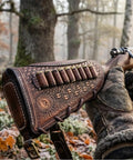 Vintage Leather No Drill Cheek Rest For Rifles And Shotguns With Buttstock Protective Pouch in a wooded setting.