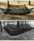 Flat Lay Hammock Tent With Bug Net And Waterproof Rain Fly For One Person set up between trees with a person resting inside.