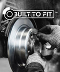 Rear brake rotor being installed on a vehicle; metallic silver brake disc with hub, gloved hands