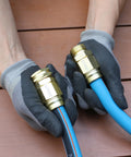 Hands holding Five Eighths Inch Garden Hose Connector Repair Fittings Set Heavy Duty Aluminum End Hose Mender with gloves