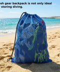 Blue mesh gear bag on beach containing fins, masks, and snorkels. Four Pack Large Mesh Gear Bags For Snorkel Gear And Wetsuits 19 By 27 Inch Drawstring Swim Bags Polyester Dive Bag Beach And Swim Equipment Organizer For Fins Masks Snorkels Goggles Travel.