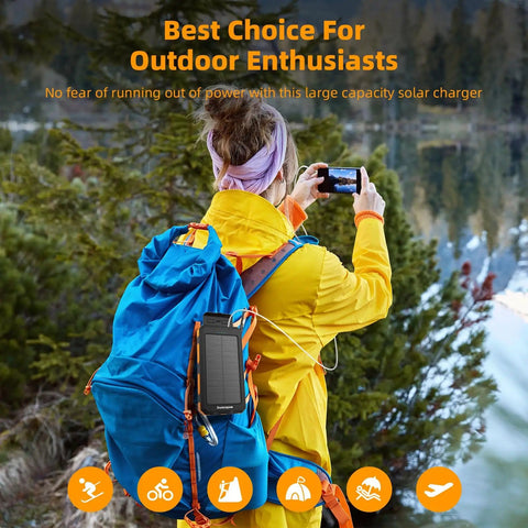Person hiking with Solar Power Bank 20,000mAh Portable Charger On The Go with USB C attached to backpack for outdoor adventures