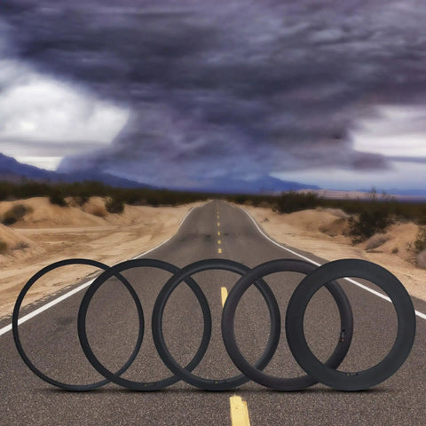700C Carbon Wheelset For Road Bikes With V-Brake, 38mm Deep Rim displayed on a desert road