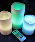 Multi Colored Flameless Candles Set Battery Operated With Remote Control Flickering Flame Ivory Wax Pillars displayed with remote