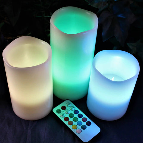 Multi Colored Flameless Candles Set Battery Operated With Remote Control Flickering Flame Ivory Wax Pillars displayed with remote