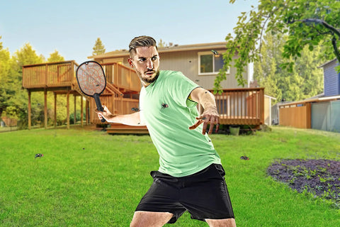 Person using Cordless Electric Fly Swatter Racket For Gnats And Mosquitoes Outdoor Indoor Bug Zapper Handheld Battery Powered Pest Control Tool For Home Patio Garden Safe For Humans Fast Easy Bug Busting in backyard