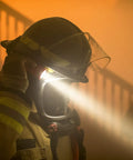 Firefighter LED Helmet Light With 180 Degree Articulating Head And Dual Beam Output in smoky environment.