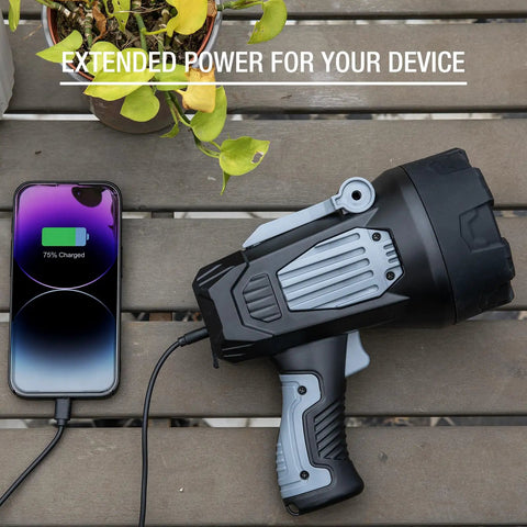 Ultra Bright Rechargeable Spotlight 2,000,000 Lumens LED Handheld Flashlight With 3 Color Lenses charging a smartphone