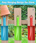Big 9 Inch Beach Sand Shovels Set For Kids And Adults hanging on a wooden fence with clay pot, showing easy storage design