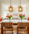 Handcrafted Boho Rattan Plug In Pendant Light With Six Watt Led Bulb And Warm 3000k Glow featuring dimmer switch over a cozy dining space.