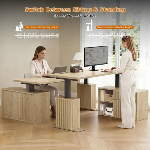 Two women using Workhorse L Shaped Standing Desk With Drawers and Cabinet Electric Height Adjustable Corner Desk