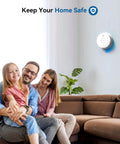 Family enjoying time together in a living room with a Top Notch Hardwired Photoelectric Smoke Alarm on the wall.
