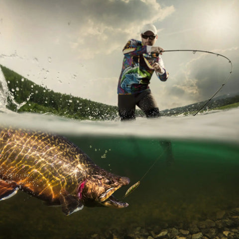 Angler using Backpacking Ready 3 Piece Fly Fishing Rod And Reel Starter Kit With 97 Inch Collapsible Fiberglass Rod catching fish.