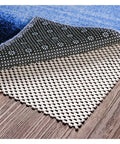 Stay Put Non Slip Area Rug Pad Gripper 5x8 Feet with Strong Grip on hardwood floor showing beige open-grid design