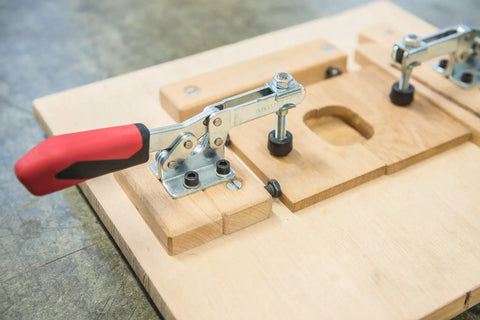 Pro Grade Horizontal Acting Toggle Clamp With Horizontal Base Size 2 Silver And Red Ergonomic Oil Resistant Handle With Large Grip For Quick Solid Clamping And Durable Stainless Hardware on wooden fixture