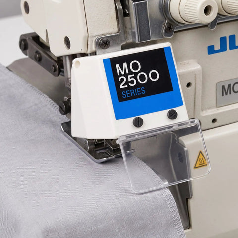 Clear Guard Eye Shield Plate Cover on MO 2500 Series machine in factory workshop, transparent protective shield.