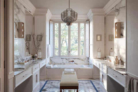 Elegant bathroom with marble surfaces, large windows, and a central bathtub