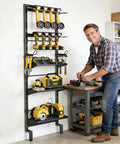 Man using a Five Tier Vertical Wall Mount Tool Storage Rack For Garage Heavy Duty Metal Organizer With Eight Drill Holder Slots Adjustable Shelves Side Hooks Space Saving Workshop Utility