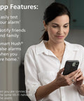 Woman interacting with smartphone app features for Top Shelf Smart Smoke Detector Delivering Wifi Connectivity Alexa Integration Hardwired Design With Battery Backup Voice And App Alerts Rock Solid Home Defense No Sweat Install Two Pack.